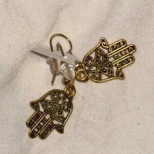 This is a pair of Hamsa hand earrings. Brand new Brass surgical metal nwt